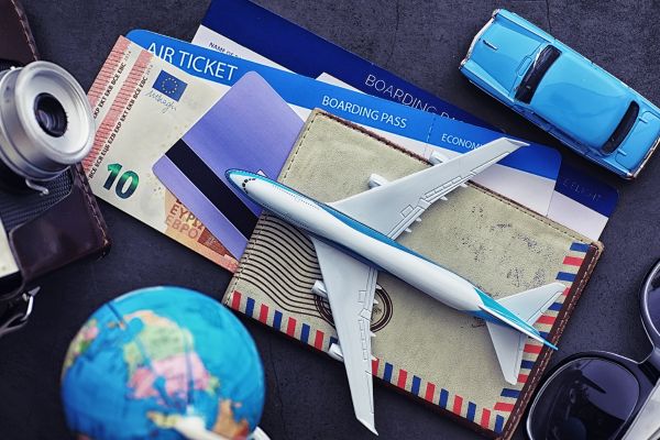 Airplane, wallet, and boarding pass